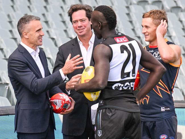 ADELAIDE, AUSTRALIA - NewsWire Photos APRIL 12, 2023: South Australian Premier Peter Malinauskas, AFL CEO Gillon McLachlan, Port Adelaide player Aliir Aliir and Adelaide Crows captain Jordan Dawson at Adelaide Oval in the lead up to Gather Round Picture: NCA NewsWire / Brenton Edwards