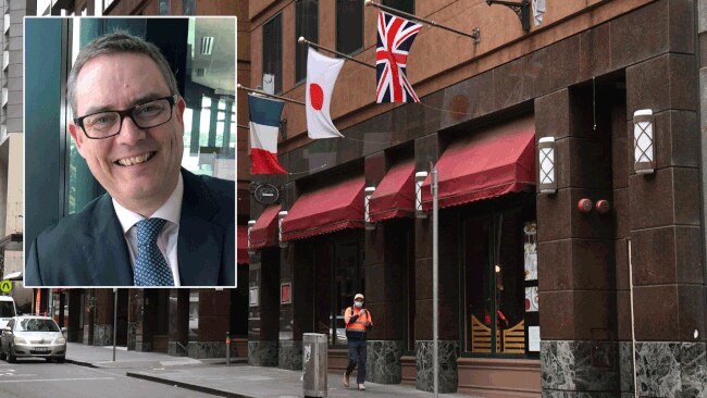 WorkSafe Victoria chief Colin Radford, inset; A man walks past the Stamford Plaza Hotel, one of the Melbourne hotels where a coronavirus outbreak occured.