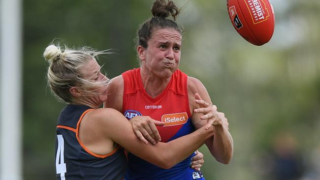 Christina Bernardi wraps up Melbourne’s Harriet Cordner. Picture: AAP