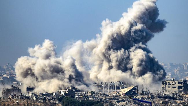 Smoke rises from buildings hit by Israeli strikes on the Gaza Strip on Friday. Picture: AFP