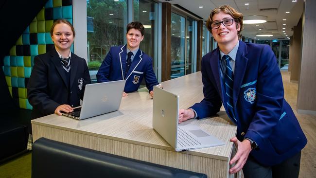 James, 16, Louisa, 16, and Aidan, 15, are taking part in a pilot course for SACE in cyber studies which begins this week at St Peters College. Picture: Tom Huntley