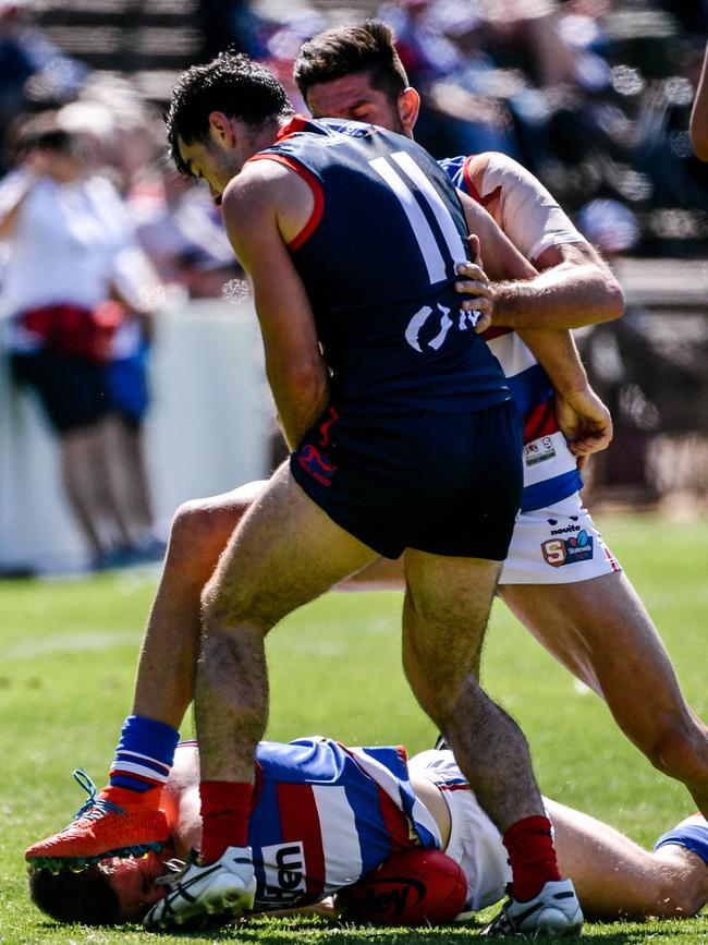 Central District’s Darcy Pisani’s head gets a boot massage from teammate Nicholas Gillard. Picture: Morgan Sette/AAP