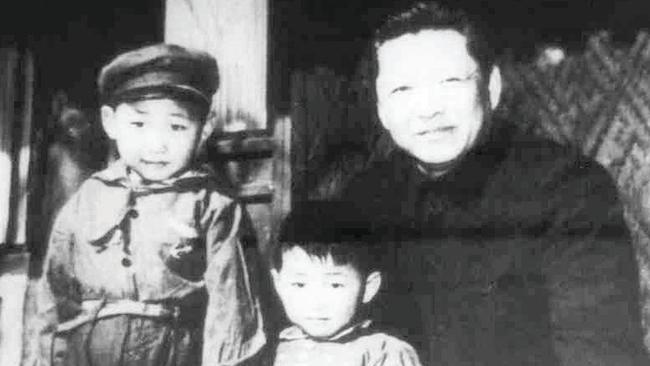 Xi Jinping, left, with his father, Xi Zhongxun, in 1958. Picture: Getty Images.