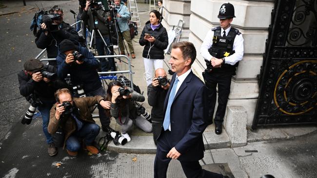 New UK Chancellor Jeremy Hunt walks from the Foreign &amp; Commonwealth Office.