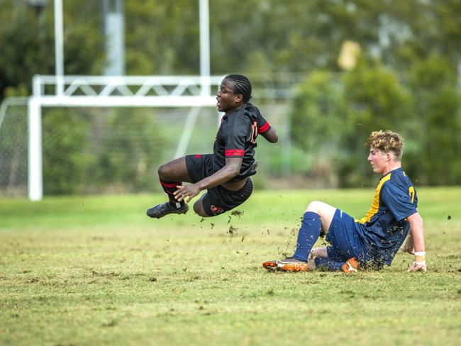 Toowoomba's Menphys-Reyne Smith tackles Christopher Morseray from St Joseph's Gregory Terrace in the First XI Football (soccer) match between St Joseph's Gregory Terrace and Toowoomba Grammar School at Tennyson, Saturday, July 25, 2020 - Picture: Renae Droop