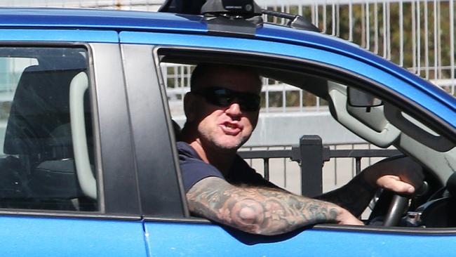A vocal local heckled Health Minister Brad Hazzard during his press conference on Friday, yelling “shame” from his car. Picture NCA Newswire / Peter Lorimer.