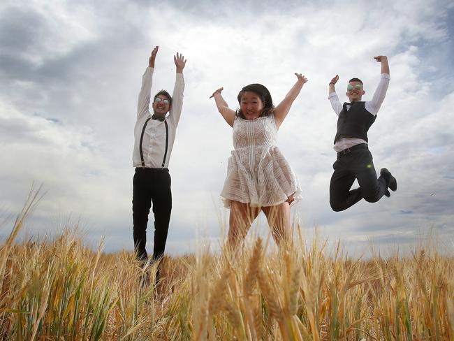 L-R: Matt Tepper, of Murtoa, Sieun Park, from Horsham and Tony Waugh, from Ballarat jump for joy at the Rupanyup Barley Banquet. Picture: Yuri Kouzmin