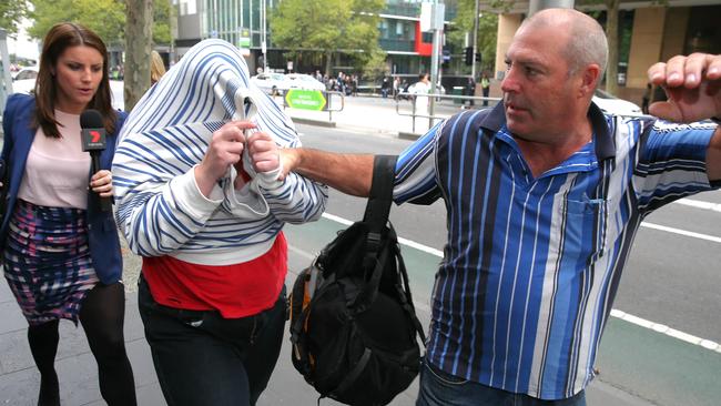 They pleaded guilty to attacking a paramedic as he tried to treat a patient. Picture: Ian Currie