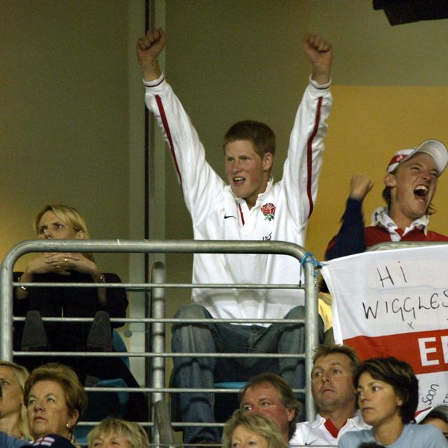 NOVEMBER 16, 2003 : Prince Harry (2nd from L) celebrates at Telstra Stadium in Sydney following  theEnglish victory in the Rugby World Cup (RWC) semi-final between England and France.