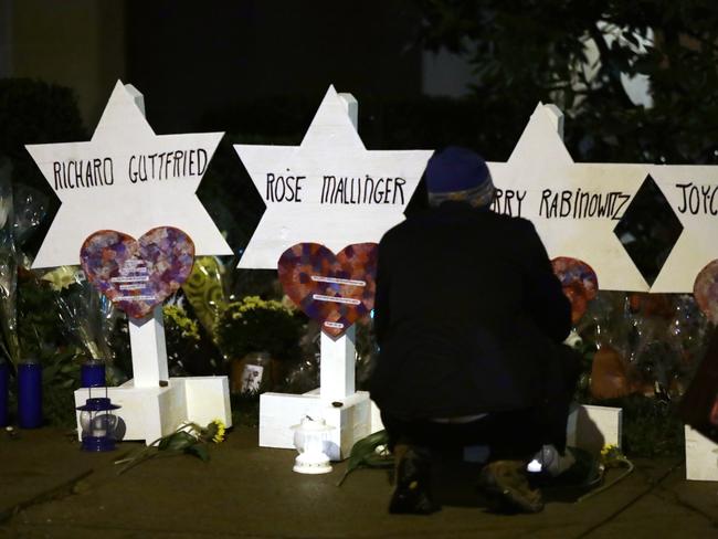 Stars of David with the names of those killed in a deadly shooting at the Tree of Life Synagogue stand in front of the synagogue in Pittsburgh, Sunday, Oct. 28, 2018. (AP Photo/Matt Rourke)