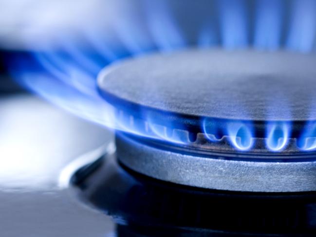 Blue flames from gas stove burner. Closeup shot of blue flames from a kitchen gas range.