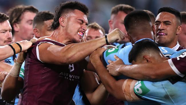 Tino Fa'asuamaleaui and Payne Haas let the fists fly in Origin II. Picture: Mark Kolbe/Getty Images