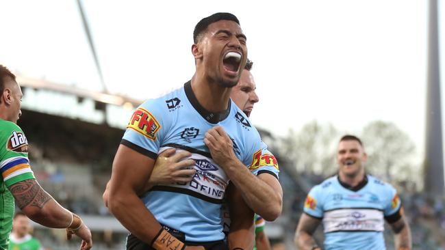 Ronaldo Mulitalo celebrates an early try for the Sharks. Picture: Mark Kolbe/Getty Images