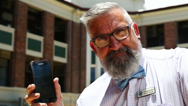 Cairns State High School banned mobile phone use in the schoolyard in 2020. Pictured is principal Christopher Zilm with some of the banned devices, which will only be permitted to be used in one building. Picture: Brendan Radke