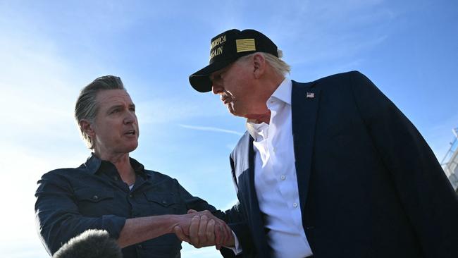 Donald Trump shakes hands with California Governor Gavin Newsom as he speaks to the press upon arrival at Los Angeles International Airport back in January. Picture: AFP