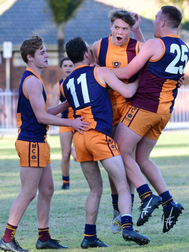 St Michael's players celebrate winning in their round two college football match against Immanuel. Picture: Leo Panzarino