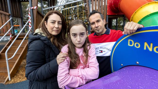 Joanna and Peter Samargis with their daughter Sophia, 12 at their local park in Hughesdale, upset about playground closures. Picture: David Geraghty