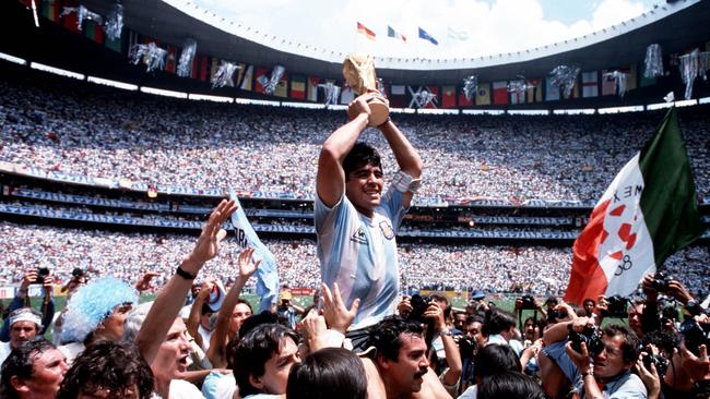 Diego Maradona holds the World Cup trophy in a scene from the documentary movie Diego Maradona. Picture: Roadshow Films