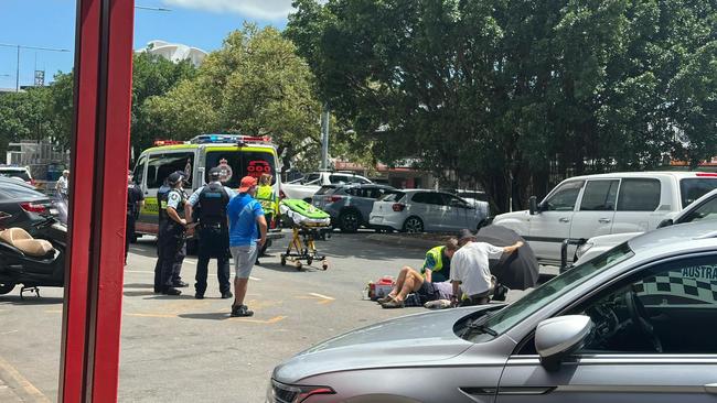 Emergency services at the scene of a vehicle and motorbike crash at Sheridan St, Cairns. Picture: Samuel Davis