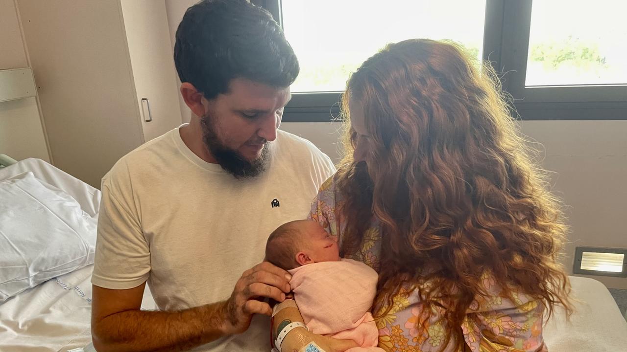 Asher Willett and Hayleigh Ciesiolka said they couldn’t wait for their daughter to experience the quintessential Territory lifestyle. Picture: Bethany Griffiths