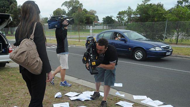 The woman who sparked the St Kilda nude photo scandal after she posted pictures on Facebook, attended Saints training littering the street with homemade flyers. Picture: Nicole Garmston