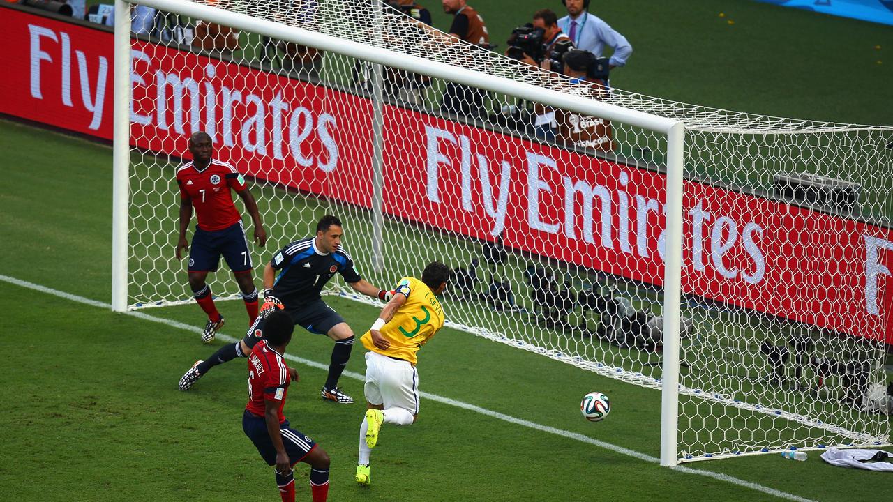 FORTALEZA, BRAZIL - JULY 04: Thiago Silva of Brazil scores his team's first goal past David Ospina of Colombia during the 2014 FIFA World Cup Brazil Quarter Final match between Brazil and Colombia at Castelao on July 4, 2014 in Fortaleza, Brazil. (Photo by Michael Steele/Getty Images)