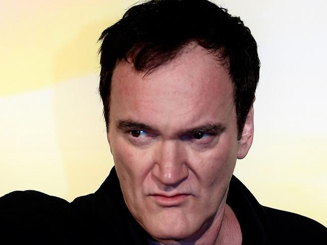 US director Quentin Tarantino gestures as he poses during a photocall ahead of the italian Premiere of Tarantino's latest movie "Once Upon A Time In Hollywood" in downtown Rome on August 2, 2019. (Photo by Filippo MONTEFORTE / AFP)