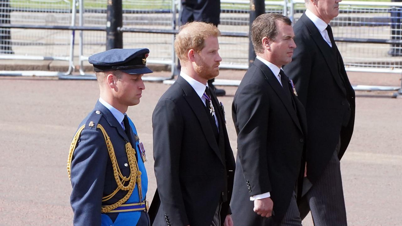 Prince William, Prince of Wales, Prince Harry, Duke of Sussex and Peter Phillips, walk behind the coffin during the ceremonial procession of the coffin of Queen Elizabeth II (Photo by Ian West - WPA Pool/Getty Images)