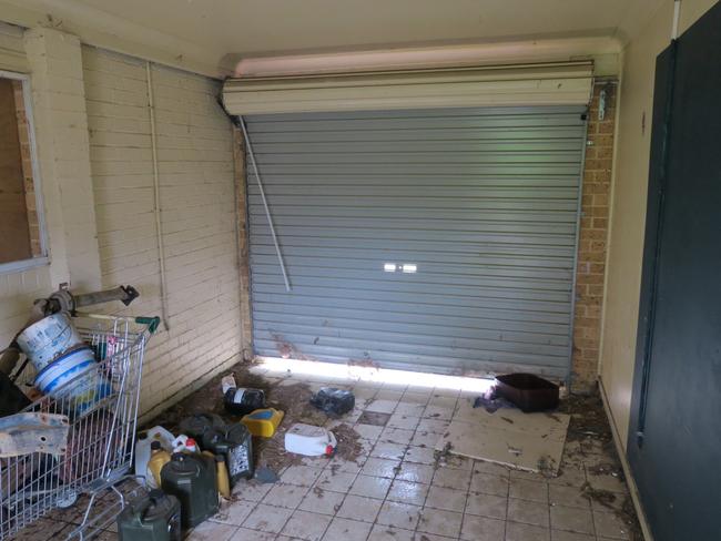 The garage of the vacant social housing duplex at 5-7 Faye Close, at Bateau Bay. Picture: supplied