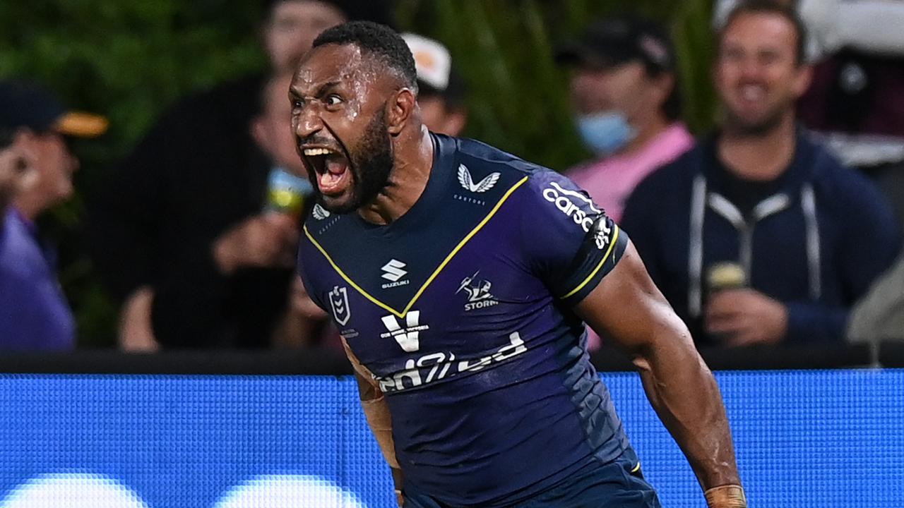 Melbourne Storm and PNG star Justin Olam celebrates after scoring a try.