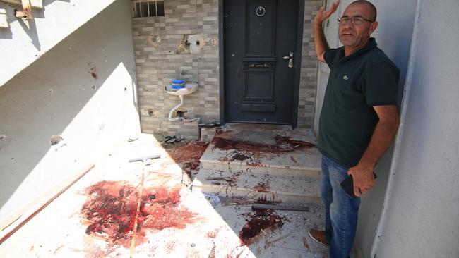 A man shows his house that is damaged after the firing with rockets by Palestinians in response to Israeli airstrikes during an operation in Ramla, Israel on October 07, 2023. Rockets landed in the city of Ramla near Tel Aviv, causing damage to parked vehicles, streets and some houses in the city. Picture: Saeed Qaq