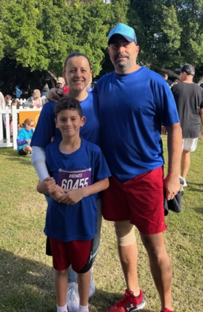 Janna Azzi with husband Danny and 7-year-old son Daniel, who raised $1000 running in the 2km Junior Dash at the Gold Coast Marathon on Saturday.