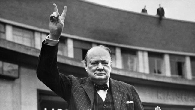 Sir Winston Churchill flashing the V-sign for victory in 1950.