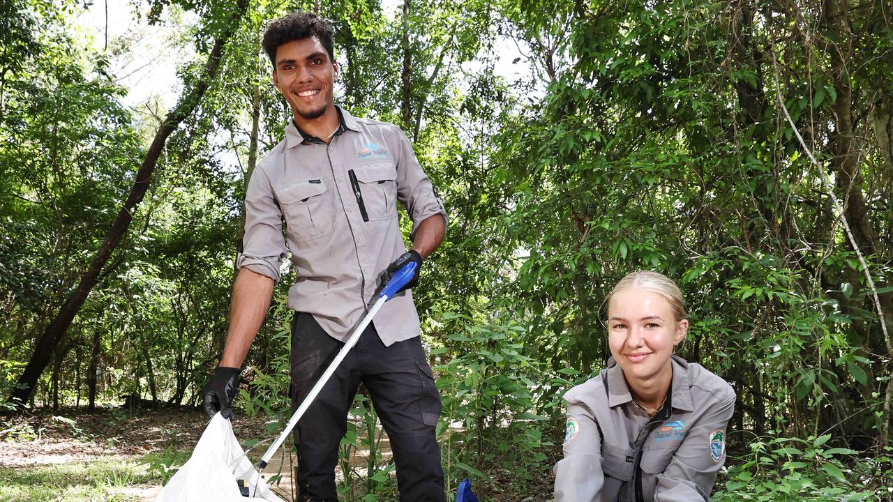 Yirrganydji Land and Sea Rangers Manoah Wallace and Taylah Mitchell collect and remove rubbish. Picture: Brendan Radke