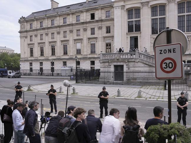 Police guard outside the courtroom ahead of the trial. Picture: AP Photo/Aurelien Morrisard