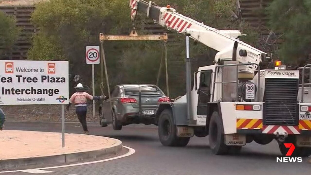 A car is towed from the O'Bahn after driving onto it on Wednesday morning. Picture: 7NEWS