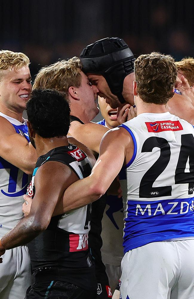 Tempers flare between Tristan Xerri and Jason Horne-Francis on Saturday. Picture: Sarah Reed/AFL Photos via Getty Images/.