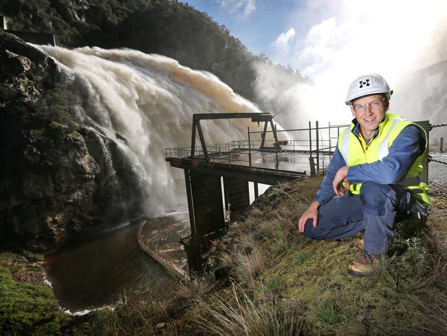 Hydro Tasmania dam safety manager Chris Topham at the flowing spillway of the Cethana Dam.