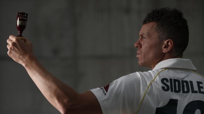 Test veteran Peter Siddle poses with a replica Ashes Urn. Picture: Ryan Pierse/Getty