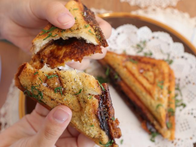 A classic Australian lunch box staple has been given a posh touch — Vegemite and Tasmanian cheese jaffle with wattle seed butter. Picture Glenn Hampson
