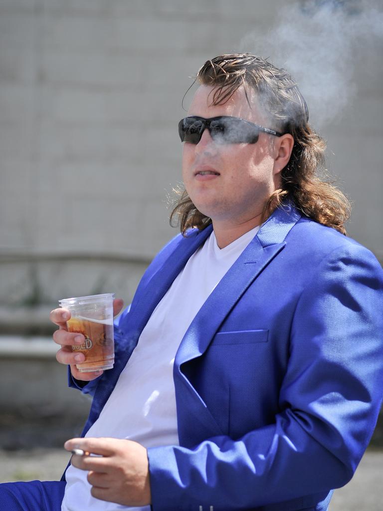 Participant Dane Wildley is seen during Mulletfest, a special event designed to celebrate the hairstyle that's all about business at the front, party at the back, Chelmsford Hotel, Kurri Kurri. (AAP Image/Perry Duffin) 