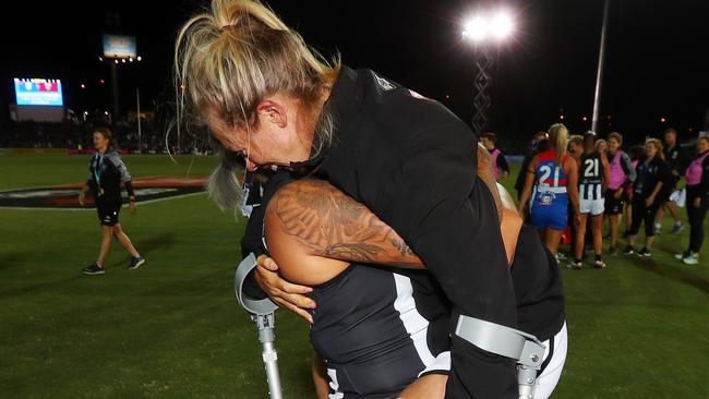 Kate Sheahan hugs Moana Hope after Collingwood’s win. Picture: Michael Klein