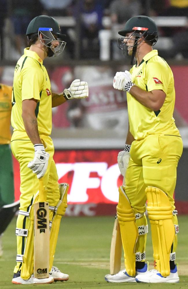 Matt Short touches gloves with captain Mitchell Marsh as Australia powers to victory over South Africa in Durban. Picture: Sydney Seshibedi/Gallo Images/Getty Images