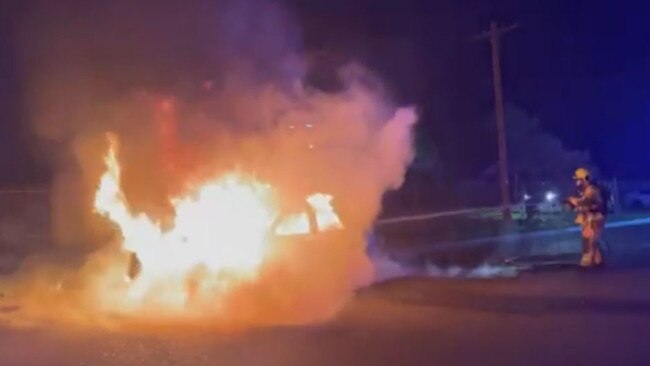 The suspected stolen car on fire in Granville. Picture: Fire and Rescue NSW