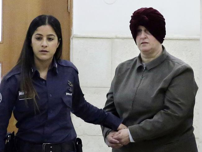 Australian Malka Leifer is brought to a courtroom in Jerusalem, Tuesday, Feb. 27, 2018. An Israeli court says an Australian woman accused of sex crimes will not be extradited for reasons of mental illness. (AP Photo/Mahmoud Illean)