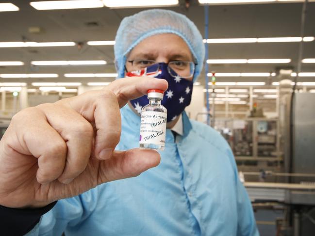 Prime Minister Scott Morrison visit to CSL serum lab to inspect COVID-19 Immunoglobulin being produced in Parkville Melbourne. PM Morrison holds a vial of AstraZeneca vaccine.    Picture: David Caird POOL IMAGES