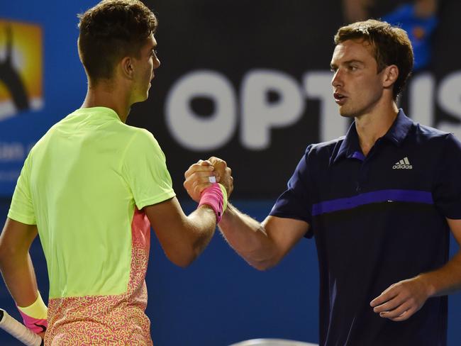 Kokkinakis is congratulated by Gulbis after his win. Picture: Paul Crock/AFP