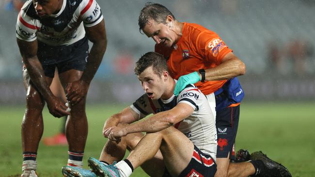 Sam Walker of the Roosters receives attention from a trainer. Photo by Ashley Feder/Getty Images