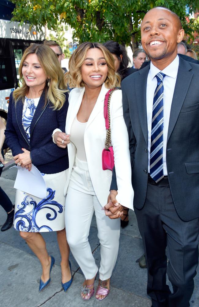 Blac Chyna (centre), pictured with Lisa Bloom and Walter Mosley, has been granted a temporary restraining order against Rob Kardashian. Picture: Matt Winkelmeyer/Getty Images