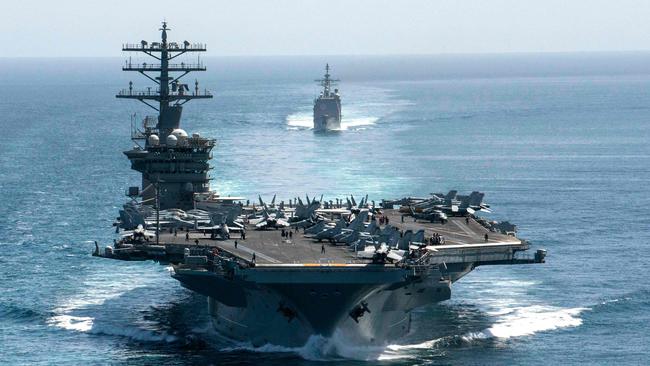 US ships like the aircraft carrier USS Nimitz and the guided-missile cruiser USS Philippine Sea, seen here in the Strait of Hormuz in September, could one day be based in Darwin as part of the American Indo Pacific fleet. Picture: Elliot Schaudt/ US Navy/AFP